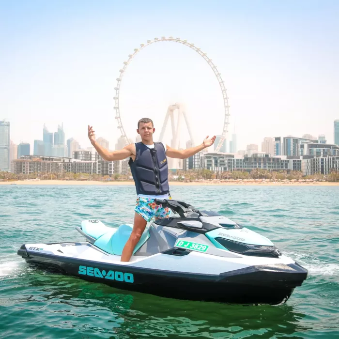 Man on a jet ski in front of Ain Dubai