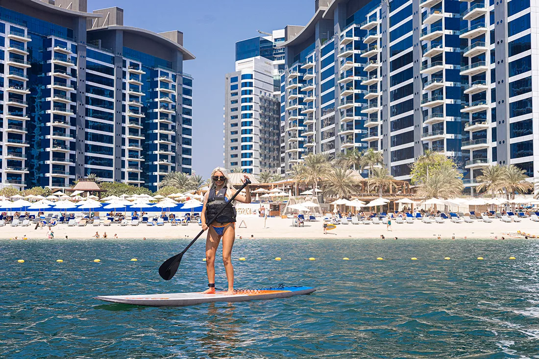 Woman enjoying stand-up-paddle (SUP) in Dubai, UAE