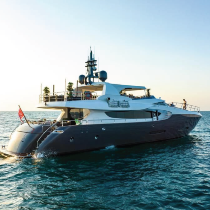 Side view of the 110ft yacht cruising in Dubai, showcasing its sleek design