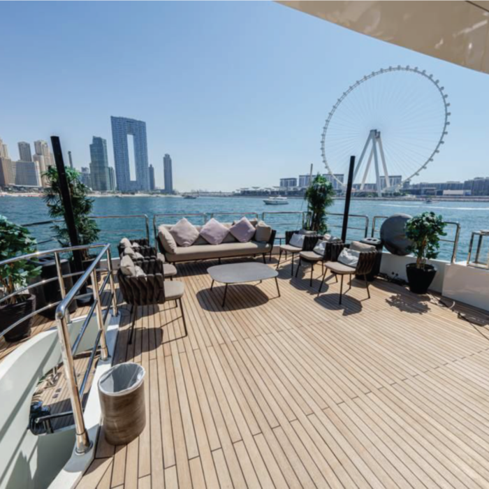 Spacious deck of the 110ft yacht with Dubai’s skyline in the background