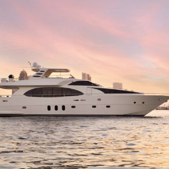 90ft private yacht cruising along Dubai’s coastline, accommodating up to 20 guests