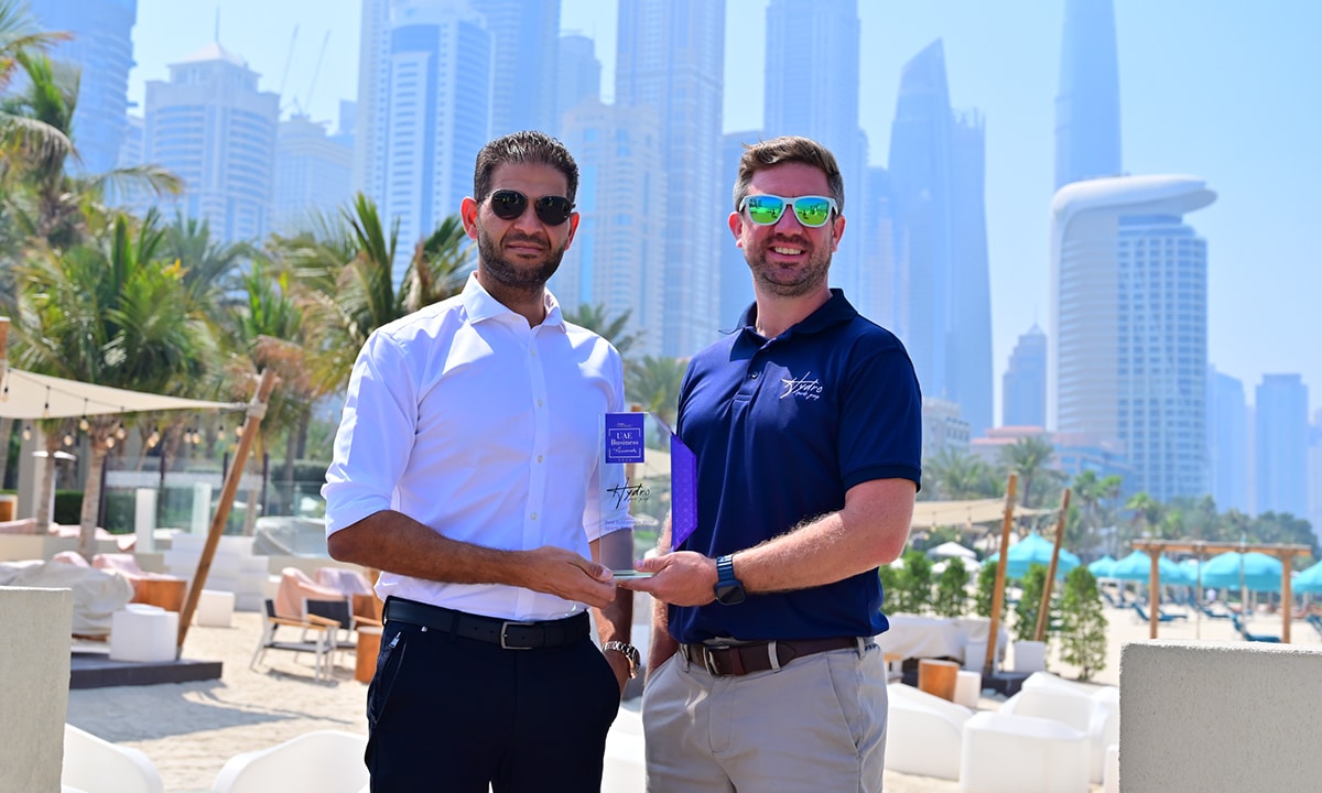 Mahmoud Torky and Joe Gates of Hydro Sports Group holding Best Sustainable Water Sports Provider 2025 award in One&Only Royal Mirage